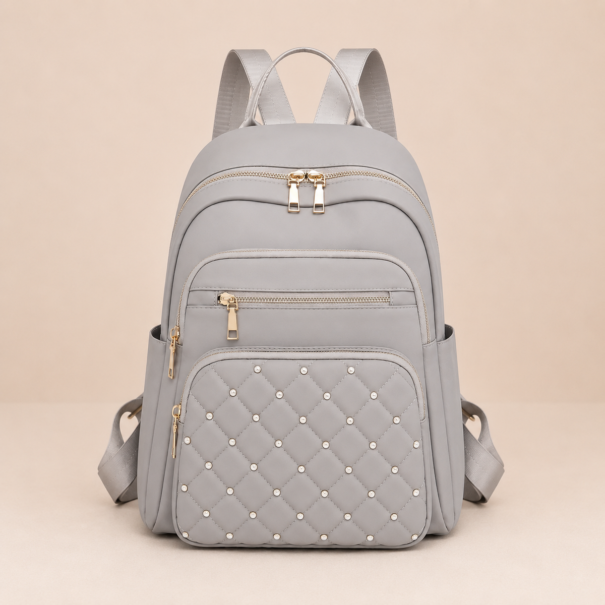 Sac a dos femme gris clair en nylon avec poches zippees et details matelasses