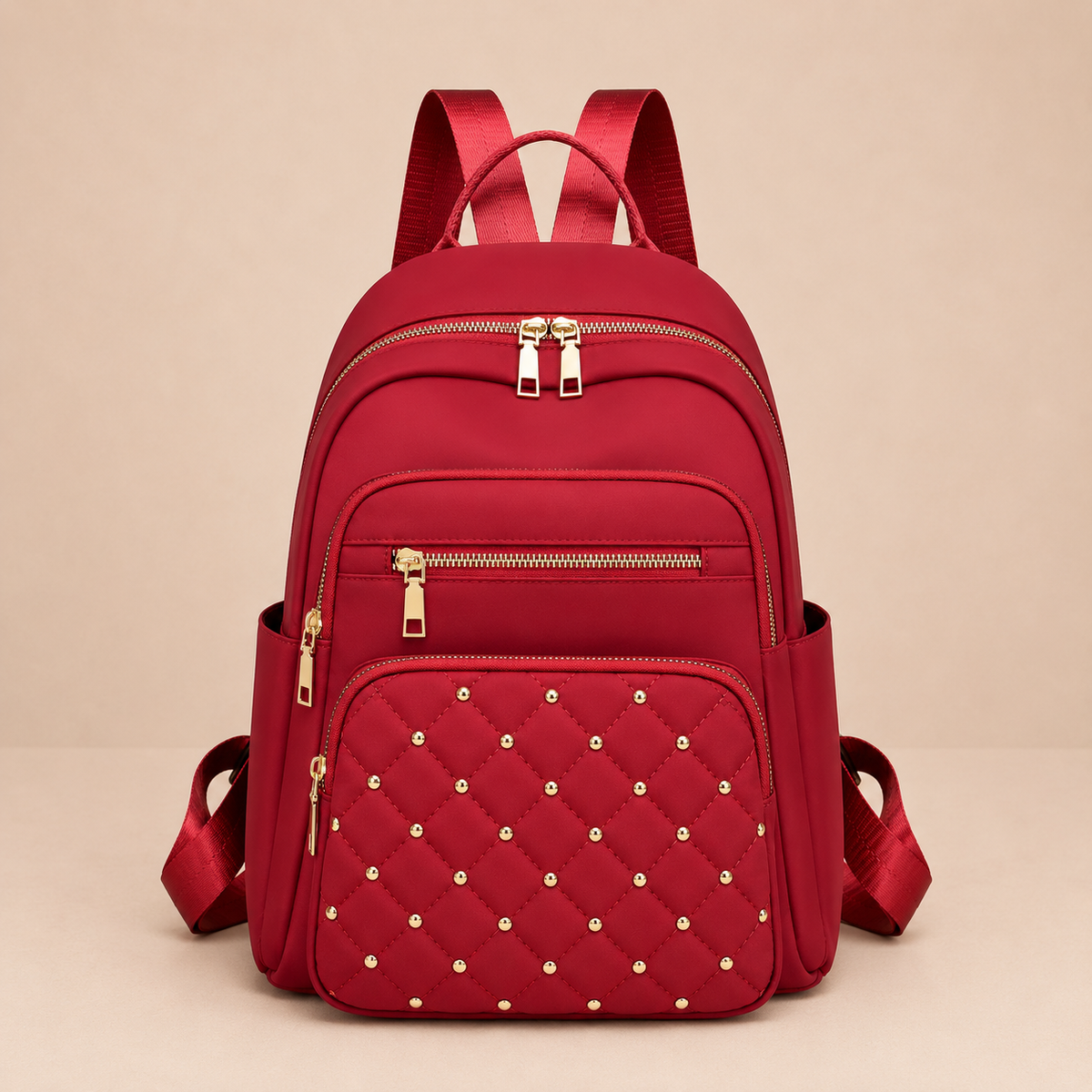 Sac a dos femme rouge en nylon avec poches zippees et details matelasses