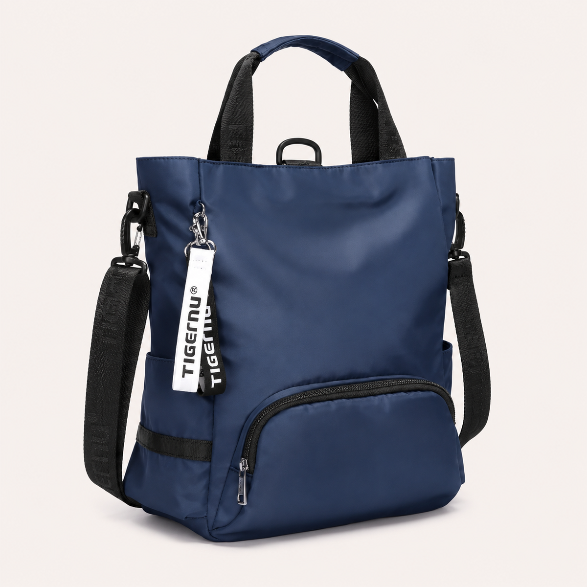 Sac ordinateur femme bleu marine TIGERNU avec bandoulière amovible, multiples poches extérieures et compartiment de rangement pour ordinateur portable.