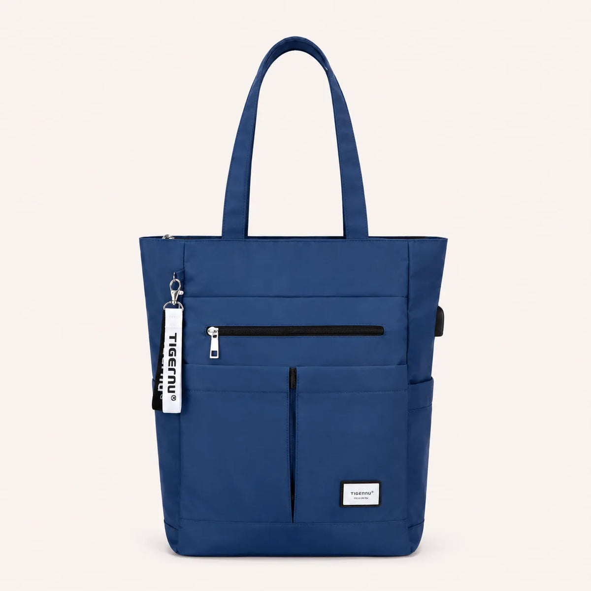 Sac ordinateur femme bleu TIGERNU avec multiples poches extérieures, fermeture zippée et grande capacité de rangement pour ordinateur portable.