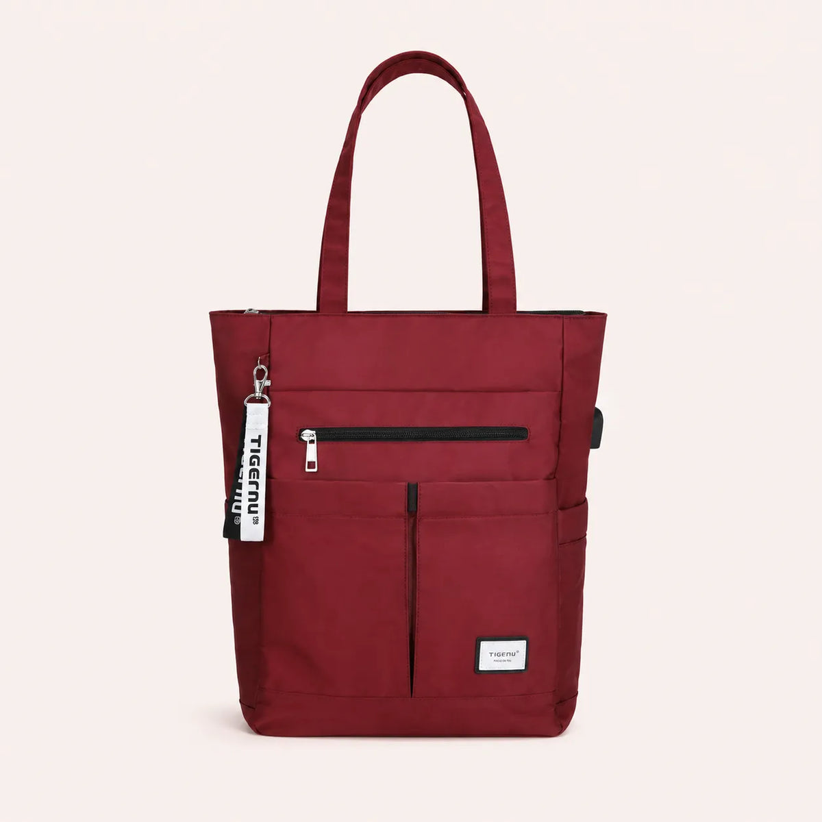 Sac ordinateur femme bordeaux TIGERNU avec multiples poches extérieures, fermeture zippée et grande capacité de rangement pour ordinateur portable.