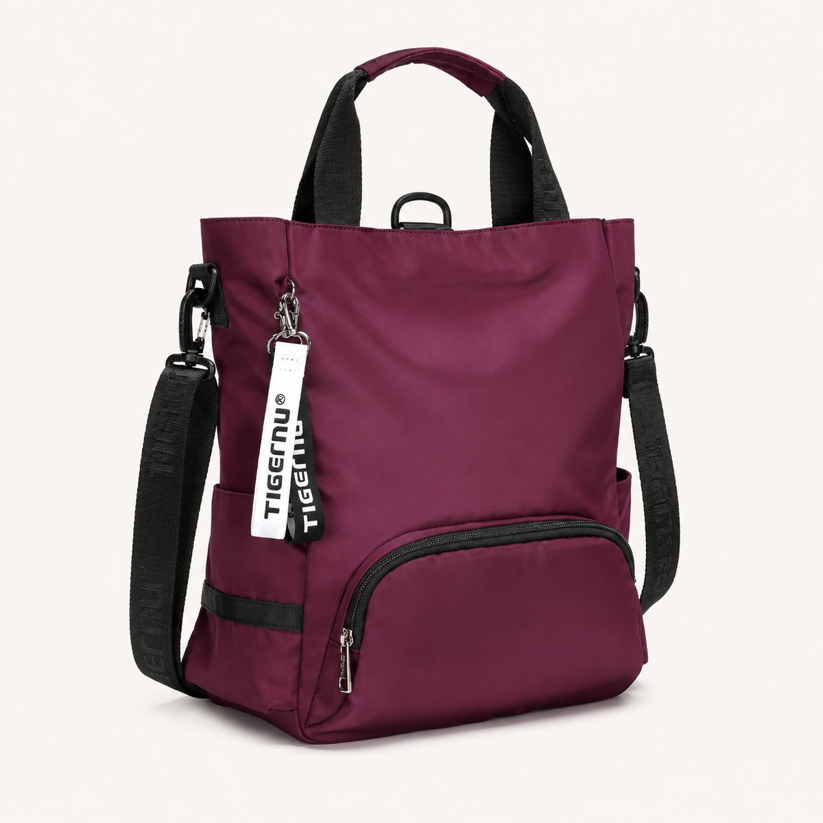 Sac ordinateur femme prune TIGERNU avec bandoulière amovible, multiples poches extérieures et compartiment de rangement pour ordinateur portable.