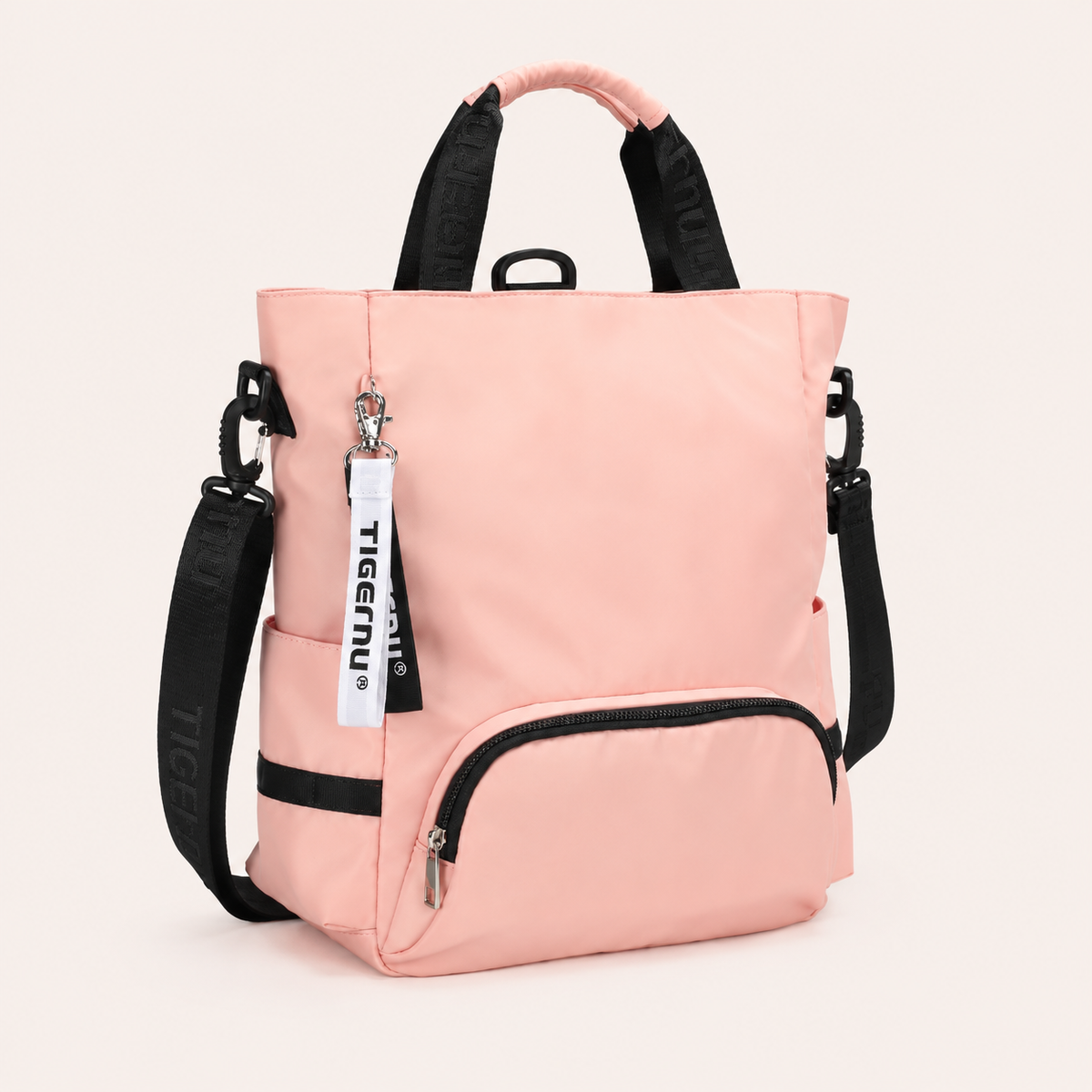 Sac ordinateur femme rose TIGERNU avec bandoulière amovible, multiples poches extérieures et compartiment de rangement pour ordinateur portable.